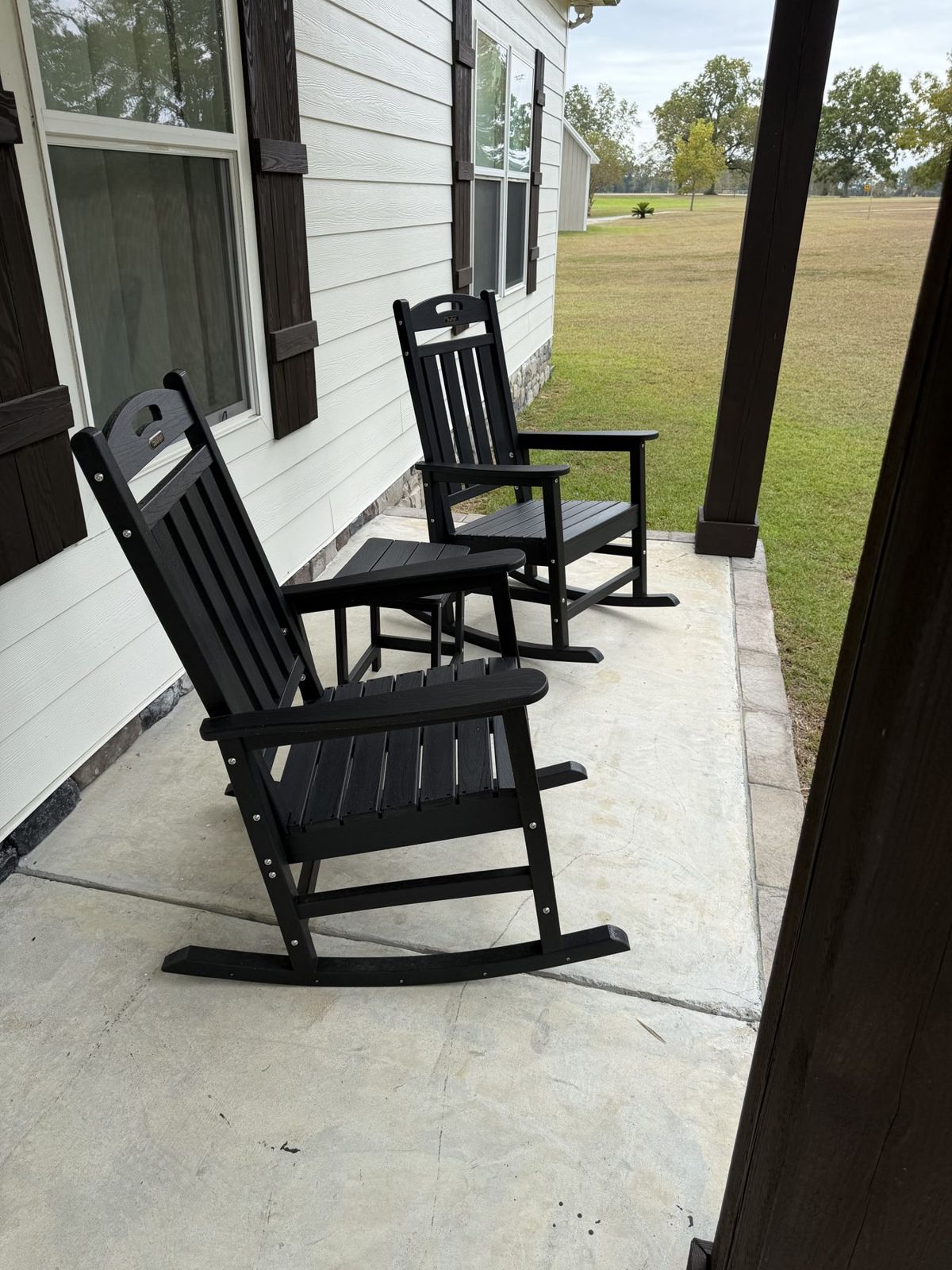 Side porch, lap siding, and stone base